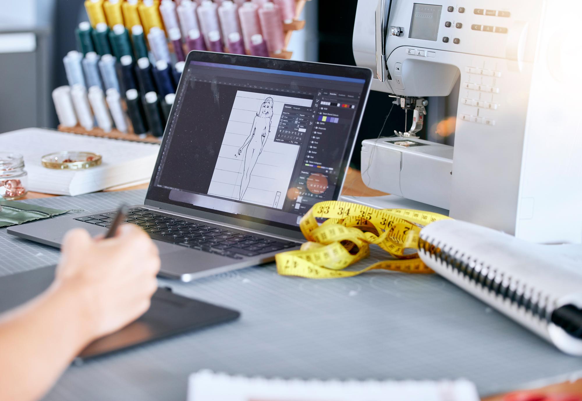atelier workstation with embroidery machine and digital tablet